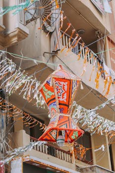 Vibrant ornate lantern decoration hanging on a lively street in Alexandria, Egypt.